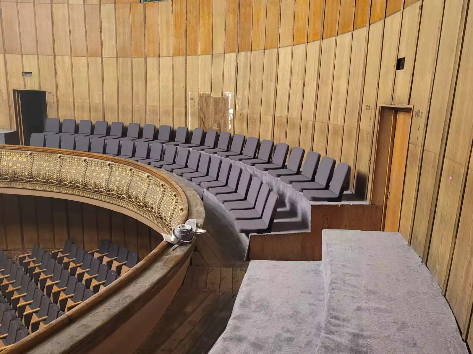 Modern auditorium installation with foldable seats designed for maximum space efficiency and comfort in a European university. Image